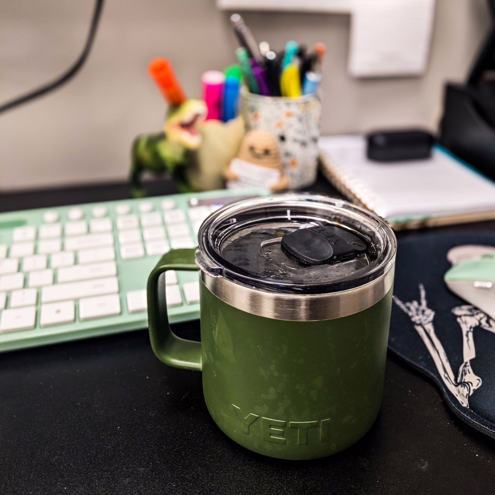 Coffee Mug at a desk with keyboard in the background